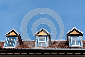 Old red roof and dormer windows