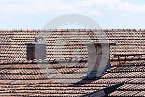 old red roof tiles and chimneys