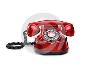 An old red telephon with rotary dial