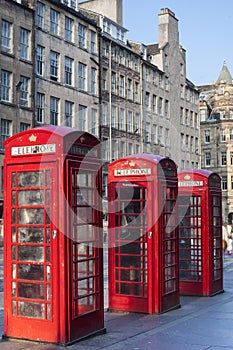 Old red telephone booths Royal mile street in Edinburgh