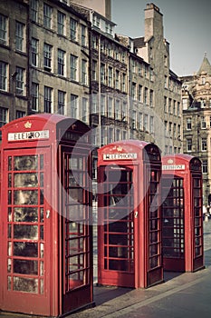 Old red telephone booths Royal mile street in Edinburgh