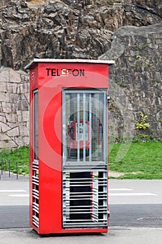 Old red telephone box in Oslo, Norway