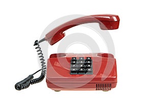 Old red telephone, isolated. Vintage red phone with taken off receiver