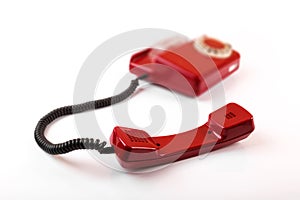 old red telephone isolated on white