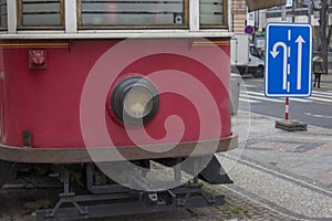 Old red tram traffic sign commands photo