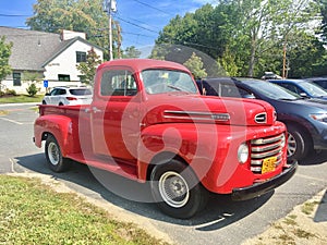 Old red vintage pick-up truck Ford