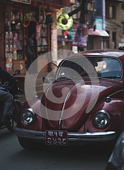 Old Red Volkswagen Beetle Oval Car Crossing Crowded Thamel Street