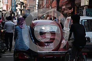 Old Red Volkswagen Beetle Oval Car Crossing Crowded Thamel Street