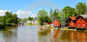 Old red warehouses alongside river Porvoo