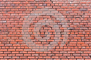 Old reddish brown worn weathered brick wall stone texture background