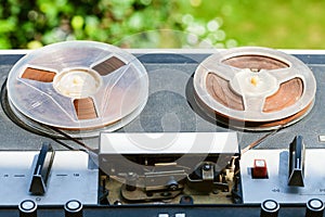 Old reel-to-reel recorder outdoors