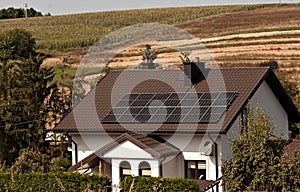 Old renovated house with solar panels on the roof.