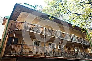Old residental building with wooden balcony. Old European architecture