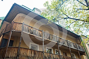 Old residental building with wooden balcony. Old European architecture