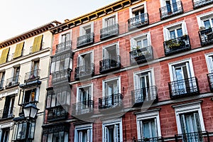 Old Residential Buildings with balconies in Chueca quarter in Madrid photo