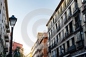 Old Residential Buildings with balconies in Chueca quarter in Madrid photo