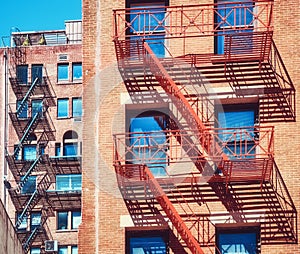 Old residential buildings with fire escapes, New York