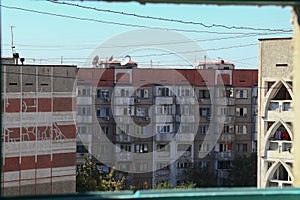 Old residential nine-story Soviet buildings in a typical area of ??the city. Landscape of old Soviet buildings, view from the wind