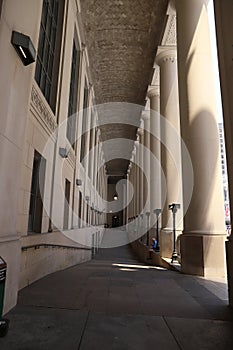 Old restored building - massive columns and a long corridor. Ancient architecture.