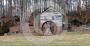 Old Restored Gristmill by the woods photo
