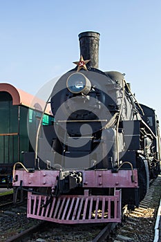 Old restored steam train with wagons