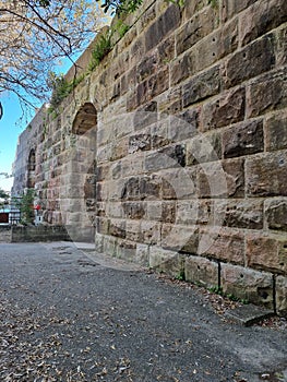 Old retaining wall at the entrance to a disused coal loading tunnel at Balls Head on Sydney Harbour