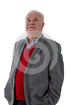 Old retired man standing looking upwards