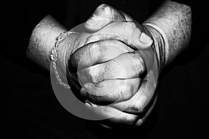 Old retired woman crossed hands