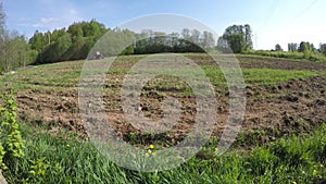 Old retro agriculture tractor working on spring field. Timelapse 4K