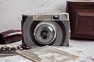 Old retro camera with old photos