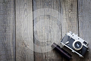 Old retro camera on vintage wooden boards