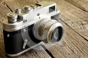 Old retro camera on vintage wooden boards