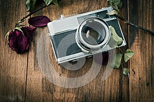 Old retro camera on vintage wooden boards