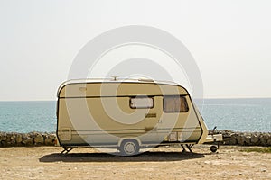 Retro caravan on the shore