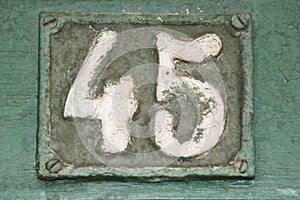 Old retro cast iron plate number 45