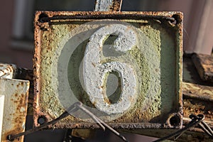 Old retro cast iron plate number 6
