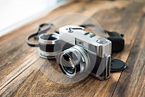 Old retro Film camera on wooden background
