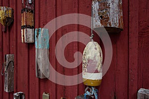 Old retro lobster buoys on the red wall