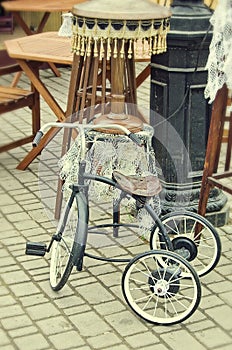 Old retro objects antique children's bicycle and floor lamp