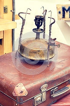 Old retro objects antique gas lamp with a suitcase, vintage image retro style effect.
