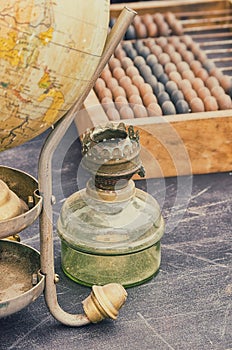 Old retro objects antique globe, gas lamps and accounting abacus