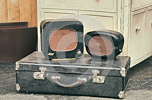 Old retro objects antique radio receivers on a valise suitcase