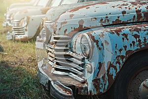 Old retro rusty abandoned and forgotten cars, cemetery of vintage autos