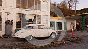 Old retro Saab in front of vintage BP Gasstation in Tingvoll in Norway photo