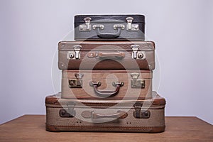 Old, retro, suitcases lie on the table with white background