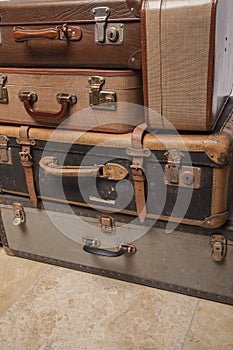 Old, retro, suitcases lie on the table with white background