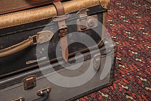 Old, retro, suitcases lie on the table with white background