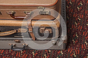 Old, retro, suitcases lie on the table with white background