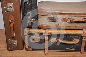 Old, retro, suitcases lie on the table with white background