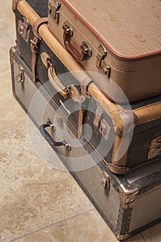 Old, retro, suitcases lie on the table with white background